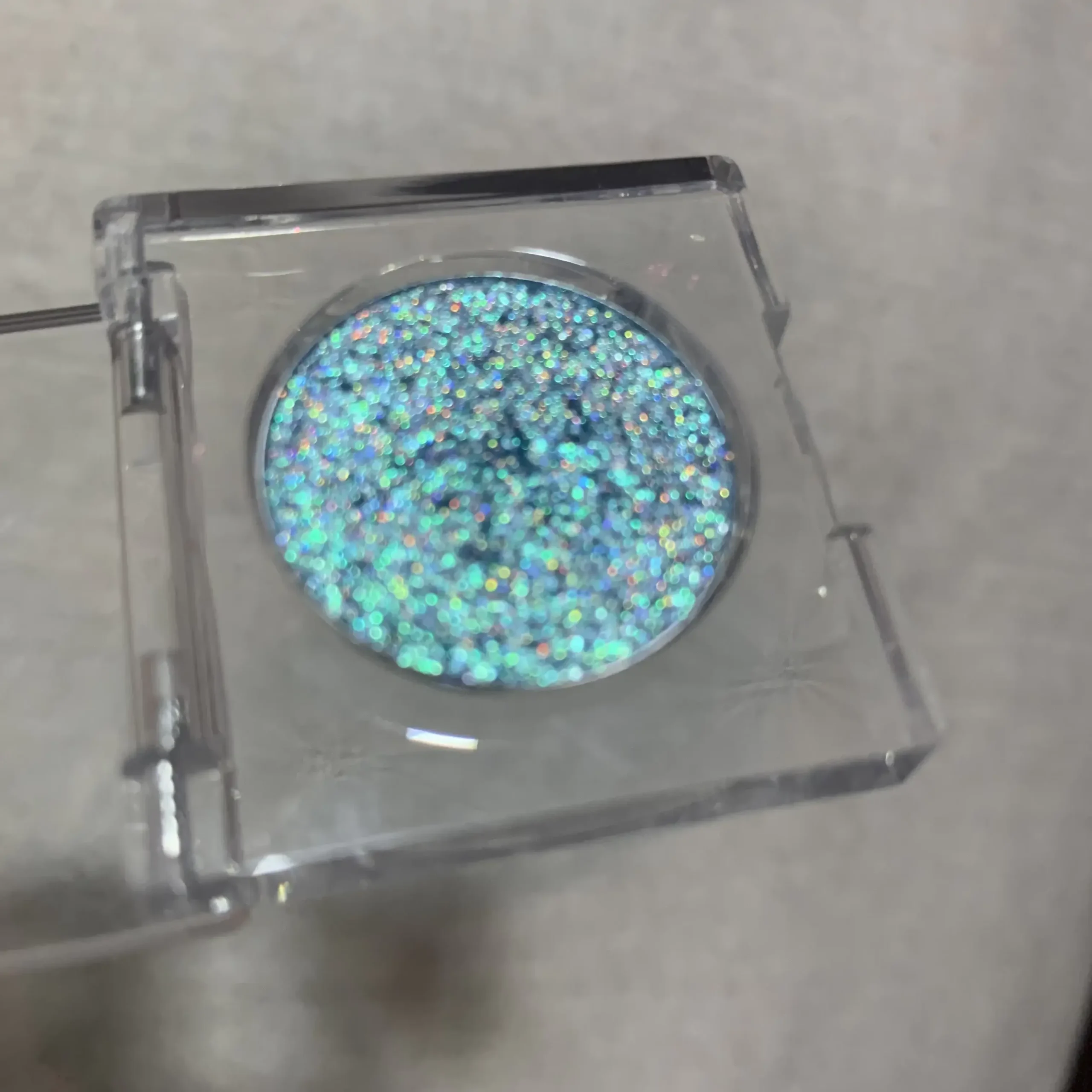 Pressed holographic eyeshadow pans and swatches